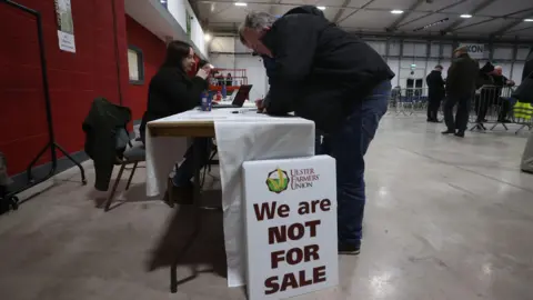 PA Media Ulster Farmers Union representatives sitting a table in the Eikon conference centre