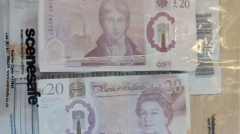 Nottinghamshire Police Counterfeit pound notes inside a plastic bag