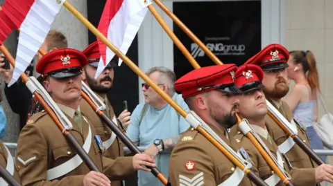A march taking place in a town centre street
