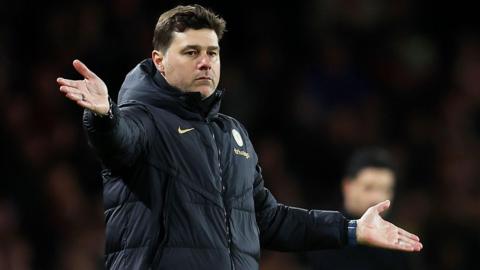 Mauricio Pochettino gestures while standing in the touchline during a match