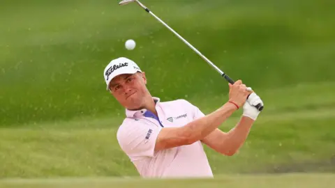 Justin Thomas hits a shot from a bunker during practice at the 2024 US PGA Championship