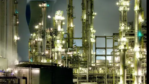 Getty Images Bright lights at a refining facility 