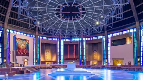 Interior view of Metropolitan Cathedral of Christ the King, Mount Pleasant, Liverpool. View from the north-east shows nave with high altar and baldacchino.