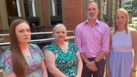 Four people from three separate families affected by poor maternity care - three women and one man are stood in front of a hotel where they met with the Health Secretary.