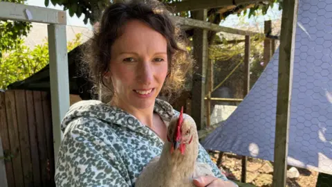 Woman holding chicken