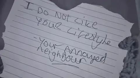 Alex Houlden A hand written note that reads: "I do not like your lifestyle" and is signed off: "your annoyed neighbour".