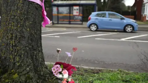 Flowers left at a nearby tree