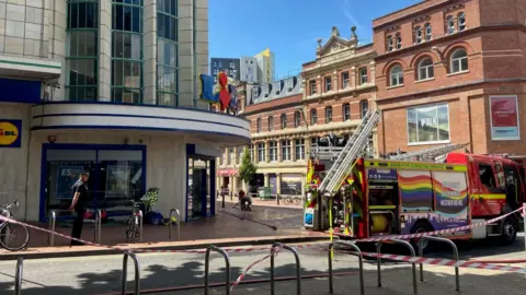 A fire engine outside a Lidl on Union Street. An area outside the shop has been cordoned off.