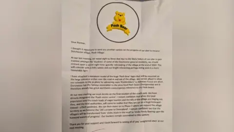 The letter in question - it has a large Winnie-the-Pooh image on the top