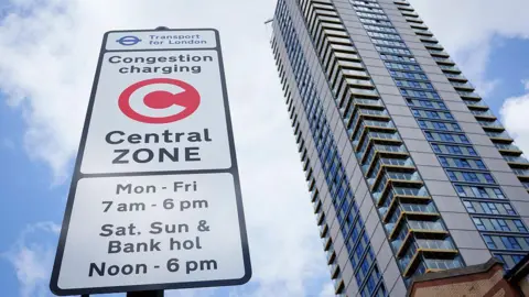 Getty Images A Congestion Charging Zone signpost beneath a high-rise residential property at Elephant and Castle.