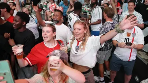 PA Media Fans watch a screening of the FIFA World Cup match between England and Congo DR at BOXPark Wembley.