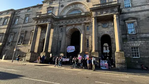 Protesters outside Old College in Edinburgh on Monday.