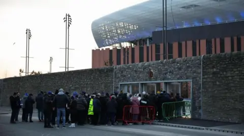 EPA / Adam Vaughan Fans queue to get into the new stadium.