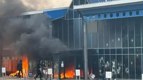 A leisure centre on fire as youths attack it