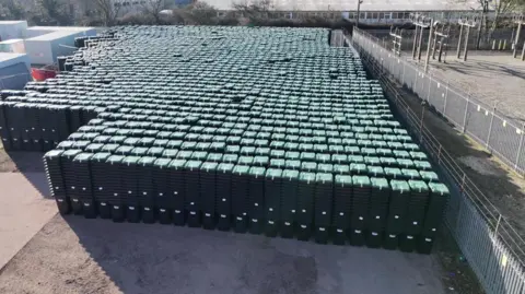 New Forest District Council A picture taken from a drone showing thousands of wheelie bins stacked in rows in an industrial park.