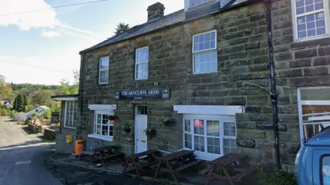 Google Exterior of a countryside pub called The Arncliffe Arms.