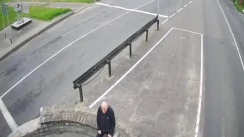 @Tsihanouskaya/X A man sits on a wall at the border