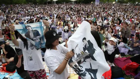 Getty Images Fans of K-pop boy band BTS gather at the Yeouido park during the 'BTS Festa', marking 10 years since the formation of K-pop group BTS, on June 17, 2023 in Seoul, South Korea. 