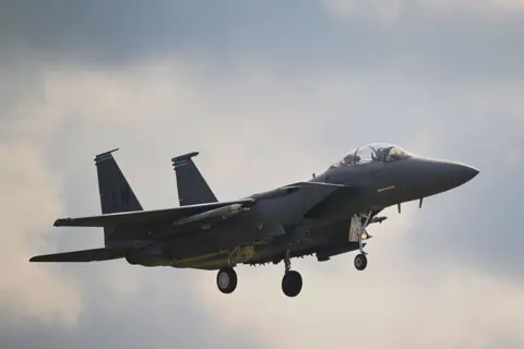 A USAF F15 Eagle aircraft in the air, coming in to land at RAF Lakenheath, UK, in July 2025