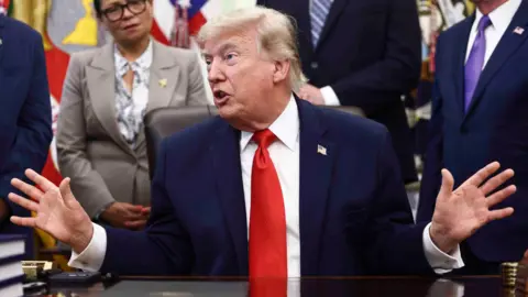 Getty Images Donald Trump sitting in the Oval office