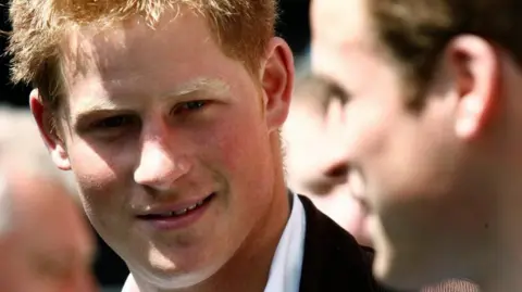 Reuters A young Prince Harry in a white shirt and black blazer