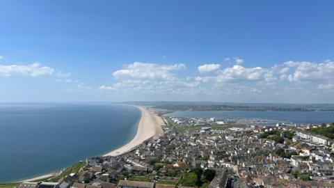 THURSDAY - Looking west along Chesil Beach from the top of Portland.