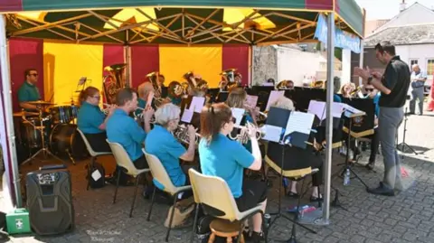 West Somerset Brass Band The brass band performing in the open