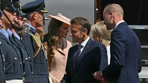 France's President Emmanuel Macron and his wife Brigitte Macron  are greeted by Prince William, Prince of Wales and Catherine, Princess of Wales