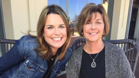 US journalist Savannah Guthrie wears a denim jacked while smiling and posing for a photo with her mother Nancy Guthrie.