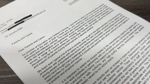 BBC The letter is laid out on the table. Its words explain Aberdeenshire Council's position on the recording of teachers and other alleged behaviour by a "small minority" of parents.