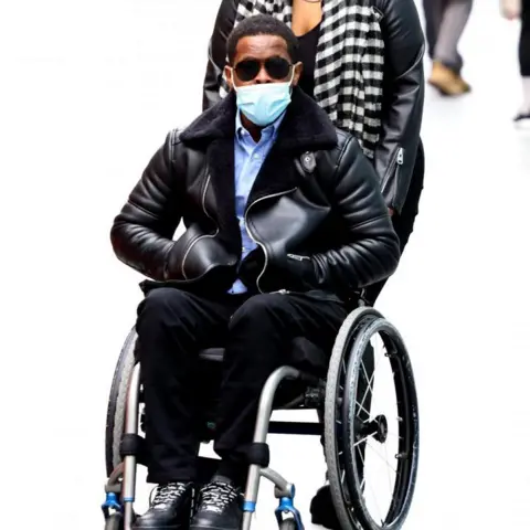 PA Media Jordan Walker-Brown, 23, arrives at court in a wheelchair on 2 May.