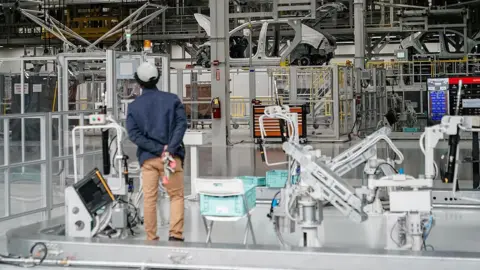 Bloomberg via Getty Images Unfinished vehicles move through a production line at the Hyundai Metaplant electric vehicle manufacturing facility in Ellabell, Georgia, US, on Wednesday, June 11, 2025.