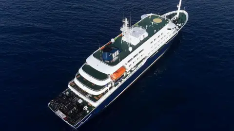 The MV Hondius - a cruise ship - docked off the coast of Cape Verde in the sea