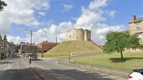 General view of Tower Street in York, with Clifford's Tower in the background.
