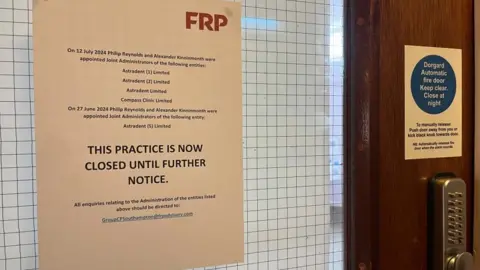 Andrew Turner/BBC Notice of administration on dentist surgery door