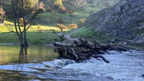 National Trust Dovedale's stepping stones obscured by water and debris