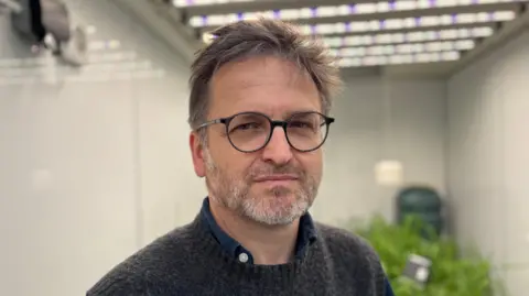 Professor Erik Murchie standing in front of one of the University of Nottingham's "growth rooms"