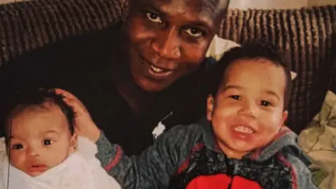Bayoh family Sheku Bayoh with his two sons