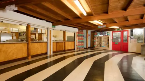 Historic England Inside of school building with black and white striped floor