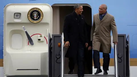 Boston Globe/Getty Images Barack Obama and Deval Patrick depart Air Force One