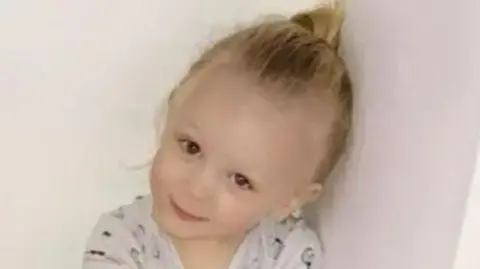 Family handout Chamiah Brindley smiling, wearing a white top