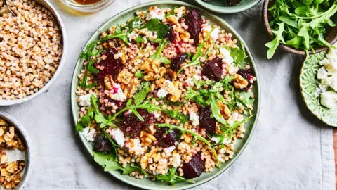 Stephen Jones Dishes and bowls which contain certain grain based foods, with rocket salad and beetroot.