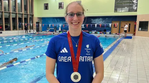 Juliette Parkin/BBC Callie-Ann Warrington with her silver medal round her neck
