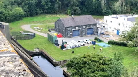 Guernsey Water's offices next to St Saviour's Reservoir seen from the Reservoir Walk