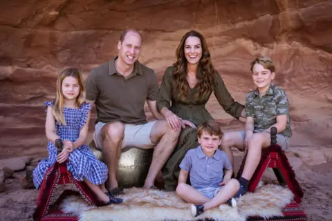 Kensington Palace Photograph from Christmas card issued by the Duke and Duchess of Cambridge showing them with their three children Prince George (right), Princess Charlotte and Prince Louis in Jordan earlier this year