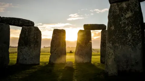 Stonehenge in front of a sunset. 