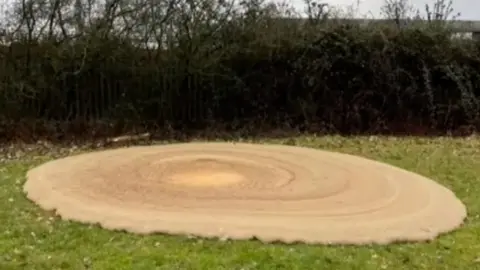 A large patch of foam appears on a rugby patch in Ruislip