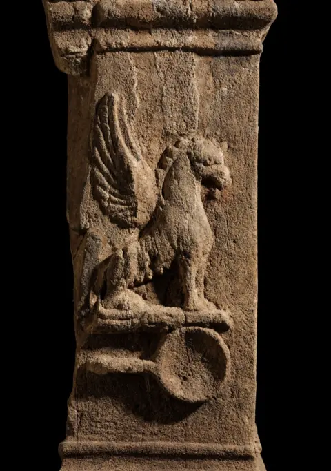 National Museums Scotland Ancient Roman altar with a griffin symbol.