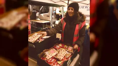 Derby Secret Santa Maria Lawrence handing out presents