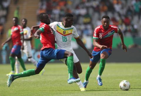 Ebou Adams and Omar Colley battle Senegal's former Waford winger Ismaila Sarr